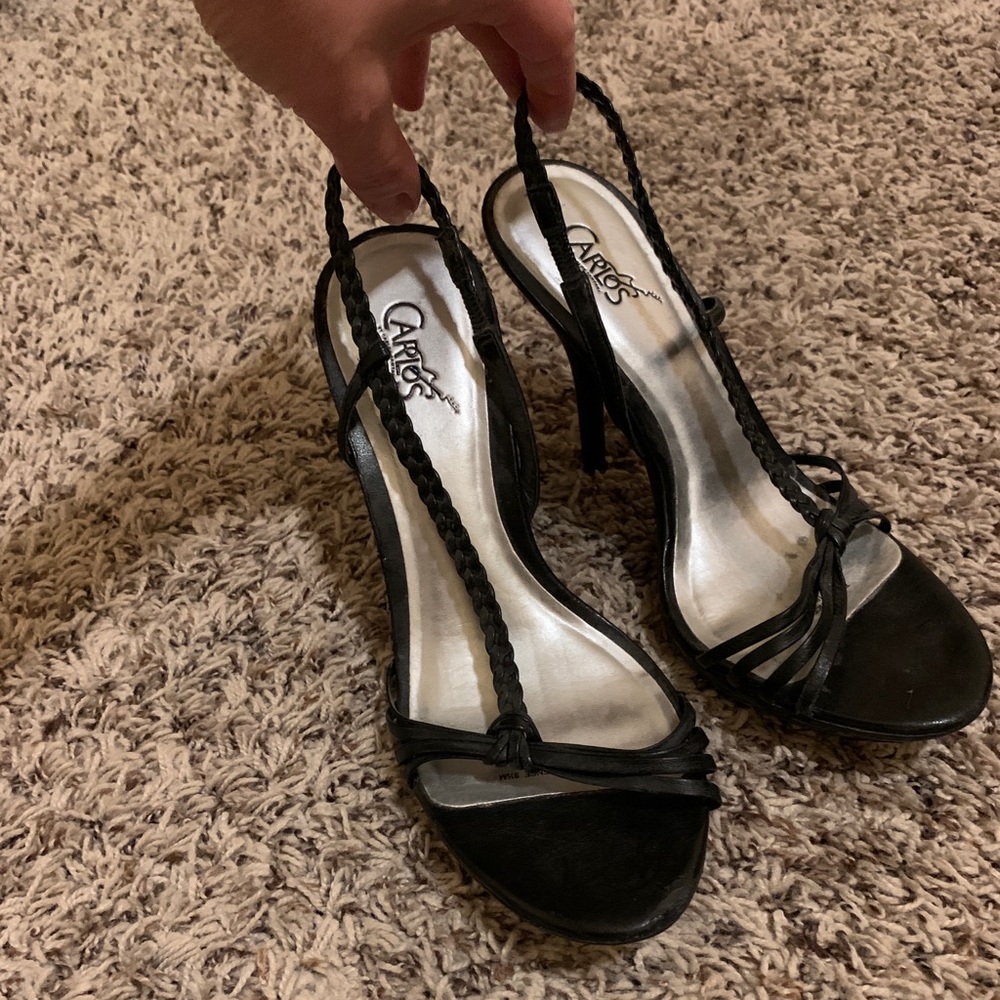 Black strappy sandals by Carlos Santana
